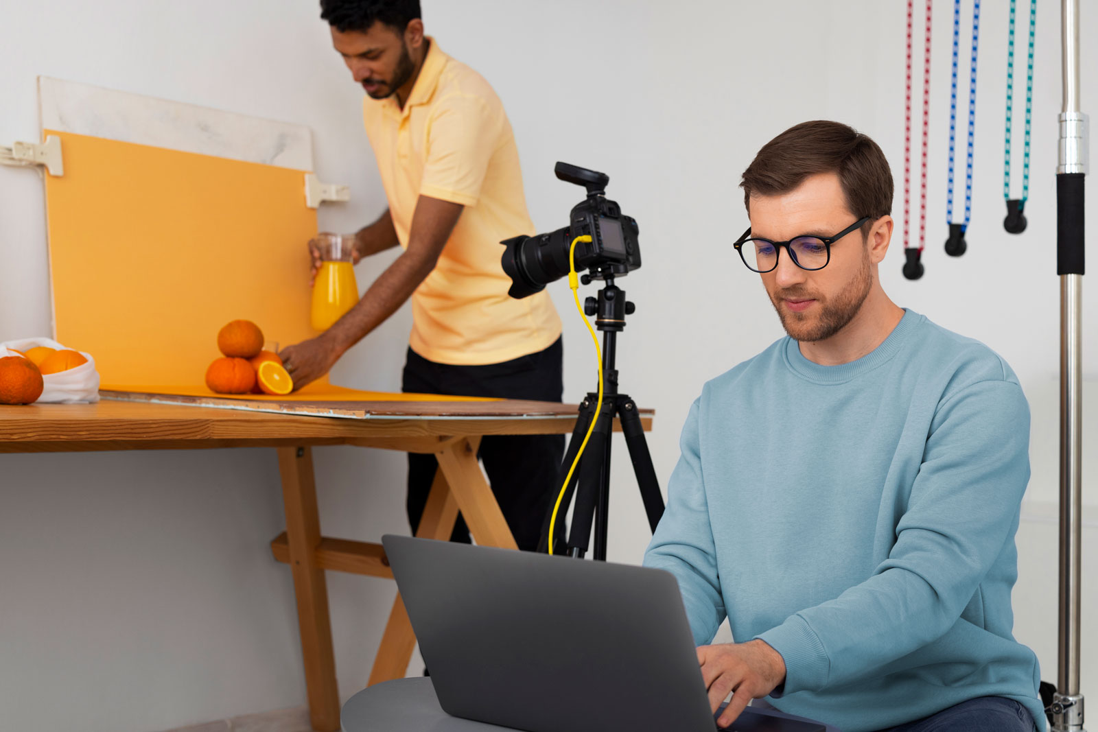 two videographers preparing to shoot video